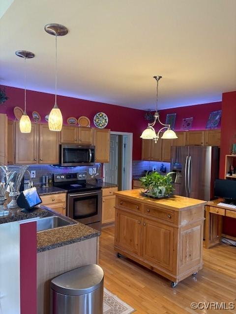 11292 Silverstone Dr, Mechanicsville, VA 23116 - kitchen with stainless steel appliances, backsplash, a kitchen island, butcher block countertops, and light wood finished floors