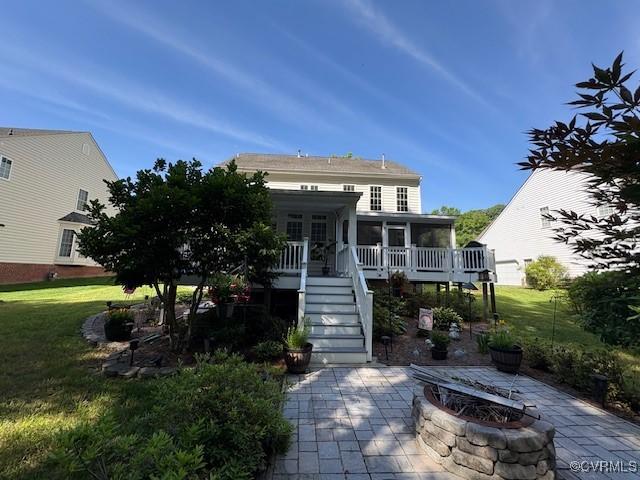 11292 Silverstone Dr, Mechanicsville, VA 23116 - back of property with stairs, a patio area, a yard, an outdoor fire pit, and a sunroom