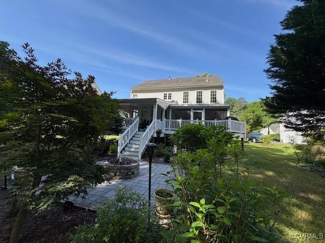 11292 Silverstone Dr, Mechanicsville, VA 23116 - back of house with a patio area, a sunroom, a fire pit, and stairs