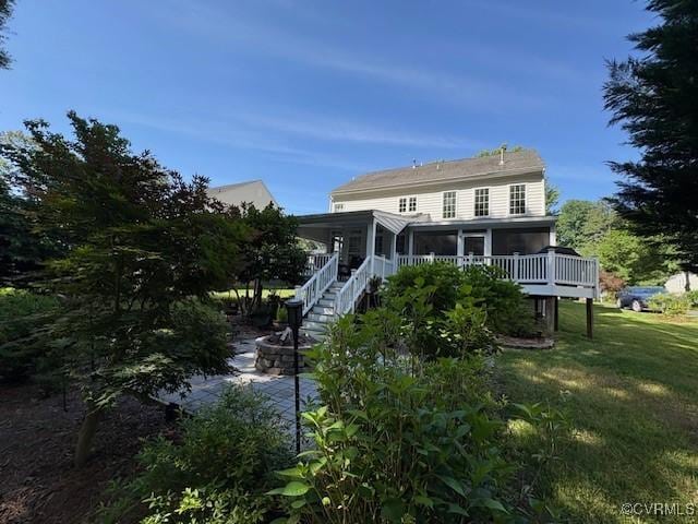 11292 Silverstone Dr, Mechanicsville, VA 23116 - rear view of house featuring a sunroom, a yard, stairs, and a deck