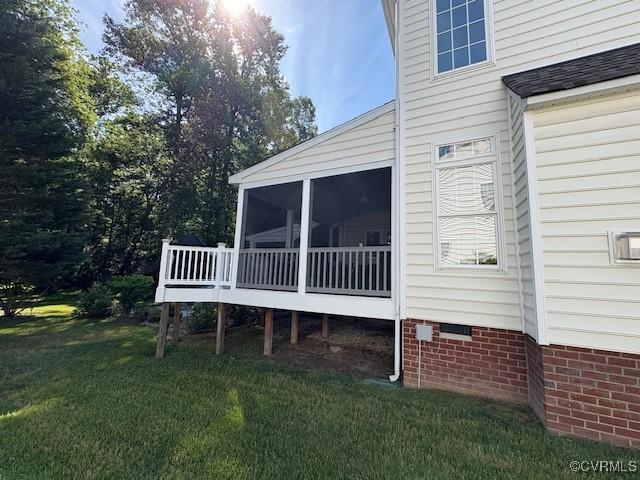 11292 Silverstone Dr, Mechanicsville, VA 23116 - view of home's exterior with a sunroom and a lawn