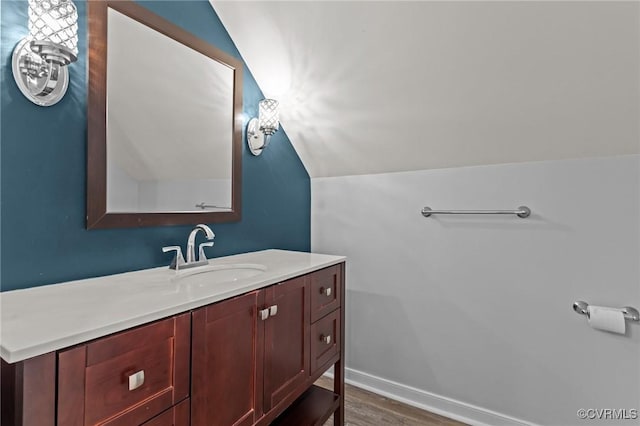8324 Longlands Pl, Chesterfield, VA 23832 - bathroom with vanity, wood finished floors, and lofted ceiling