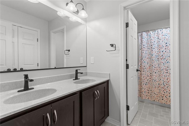 8324 Longlands Pl, Chesterfield, VA 23832 - bathroom with double vanity, baseboards, and curtained shower