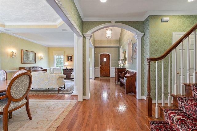 522 Hunt Field Rd, Manakin Sabot, VA 23103 - foyer entrance with arched walkways, wood-type flooring, stairs, ornamental molding, and wallpapered walls