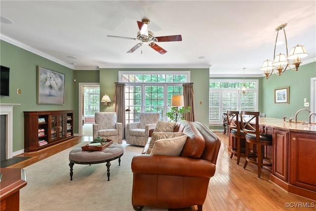 522 Hunt Field Rd, Manakin Sabot, VA 23103 - living room with ornamental molding, a chandelier, a ceiling fan, light wood-type flooring, and a fireplace with flush hearth