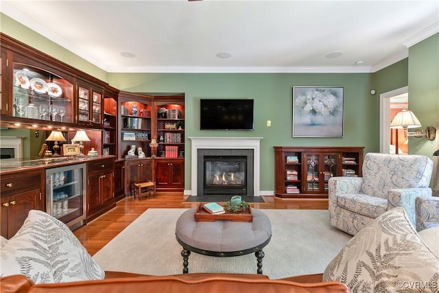 522 Hunt Field Rd, Manakin Sabot, VA 23103 - living area featuring beverage cooler, a fireplace with flush hearth, wood finished floors, and crown molding