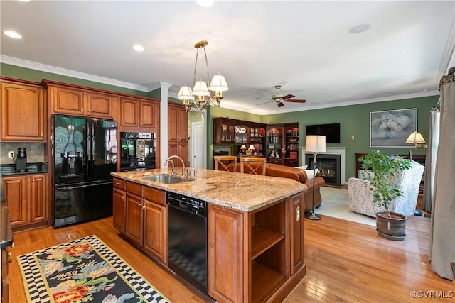 522 Hunt Field Rd, Manakin Sabot, VA 23103 - kitchen featuring black appliances, a sink, a ceiling fan, brown cabinetry, and ornamental molding