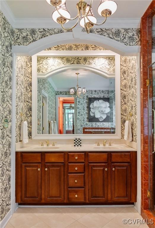 522 Hunt Field Rd, Manakin Sabot, VA 23103 - full bath with a chandelier, wallpapered walls, ornamental molding, double vanity, and tile patterned floors