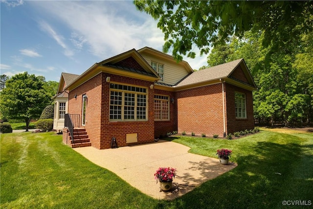 522 Hunt Field Rd, Manakin Sabot, VA 23103 - rear view of property featuring a lawn, brick siding, a patio, and a shingled roof