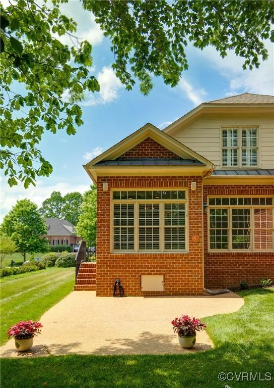 522 Hunt Field Rd, Manakin Sabot, VA 23103 - back of property with brick siding, a yard, and a patio area