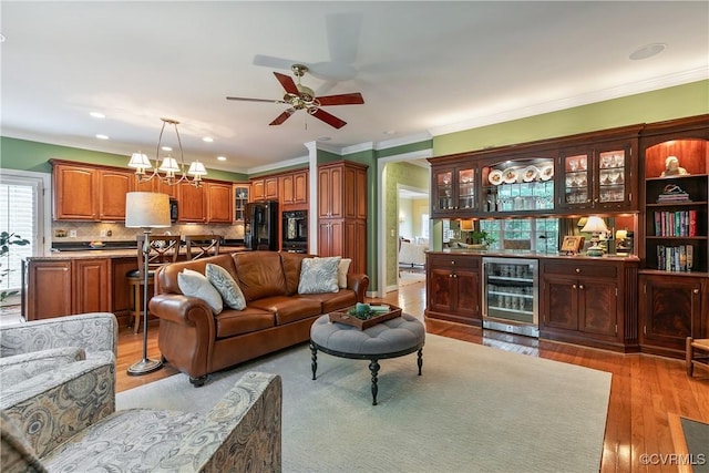 522 Hunt Field Rd, Manakin Sabot, VA 23103 - living area with wine cooler, bar area, ornamental molding, light wood-style floors, and ceiling fan