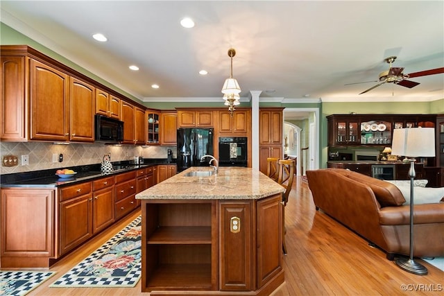 522 Hunt Field Rd, Manakin Sabot, VA 23103 - kitchen with black appliances, light wood-style flooring, a sink, ceiling fan, and crown molding
