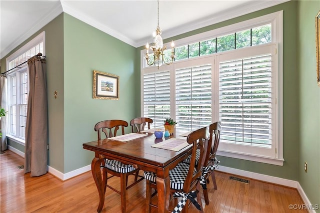 522 Hunt Field Rd, Manakin Sabot, VA 23103 - dining area with a chandelier, baseboards, light wood finished floors, and crown molding