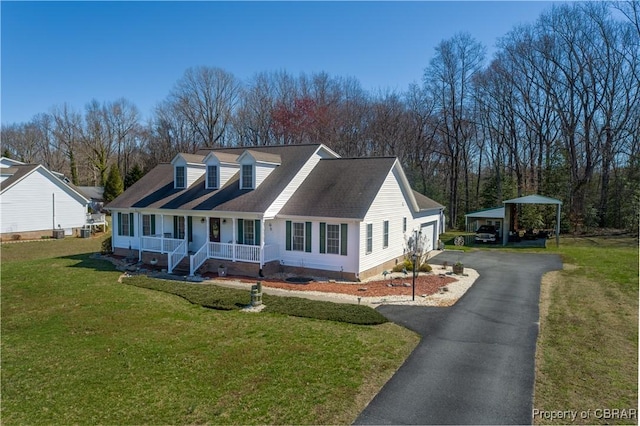 274 Meadow Dr, Tappahannock, VA 22560 - cape cod-style house with a porch, a front yard, and asphalt driveway