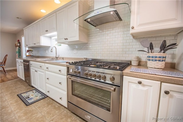 274 Meadow Dr, Tappahannock, VA 22560 - kitchen featuring stainless steel appliances, exhaust hood, a sink, light countertops, and white cabinetry