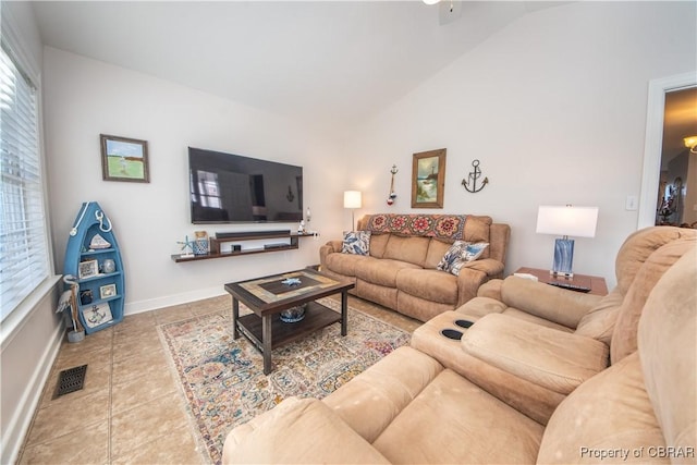 274 Meadow Dr, Tappahannock, VA 22560 - tiled living room with vaulted ceiling, plenty of natural light, and baseboards