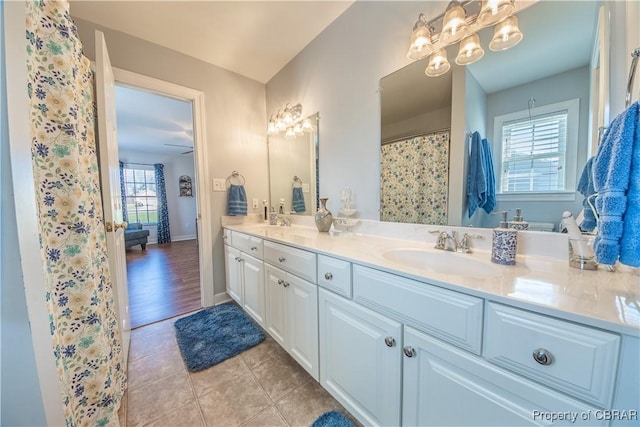 274 Meadow Dr, Tappahannock, VA 22560 - full bath with double vanity, tile patterned floors, and baseboards