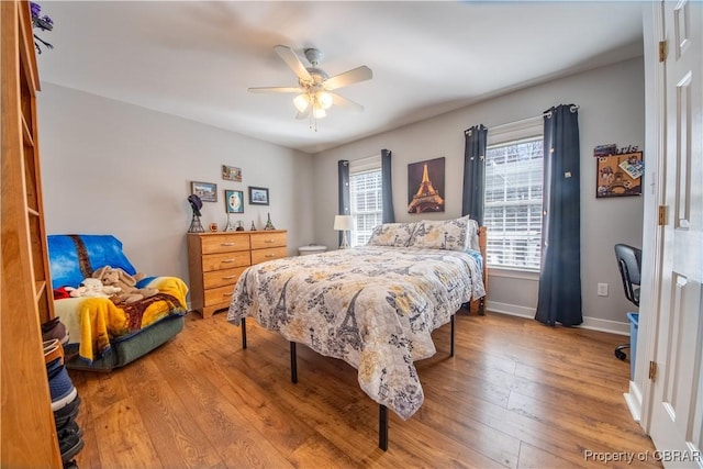 274 Meadow Dr, Tappahannock, VA 22560 - bedroom featuring wood finished floors, baseboards, and ceiling fan