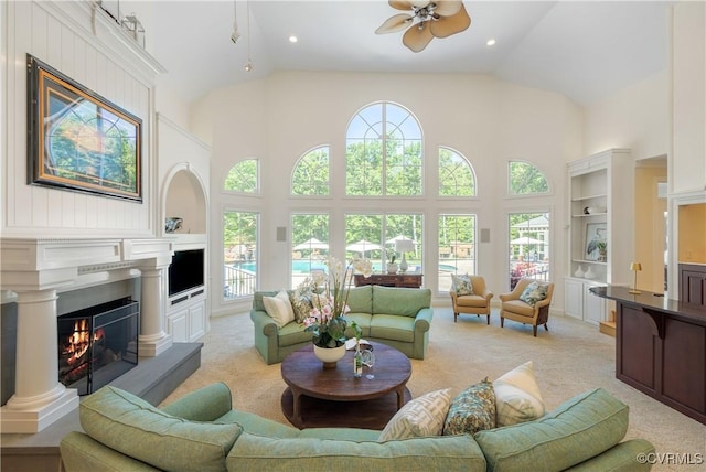 203 Randolph Square Ln, Richmond, VA 23238 - living area featuring light colored carpet, a lit fireplace, high vaulted ceiling, ceiling fan, and recessed lighting