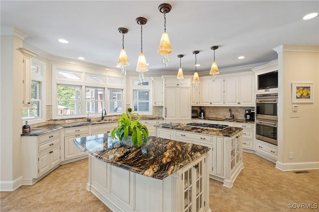 203 Randolph Square Ln, Richmond, VA 23238 - kitchen featuring a kitchen island, stainless steel appliances, decorative backsplash, a sink, and recessed lighting