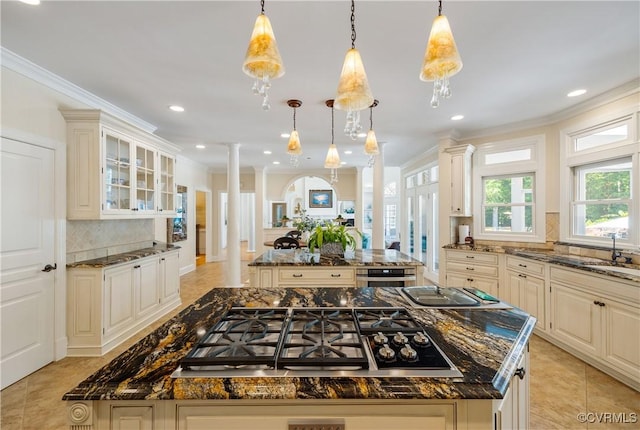203 Randolph Square Ln, Richmond, VA 23238 - kitchen with a center island, decorative columns, appliances with stainless steel finishes, backsplash, and dark stone countertops