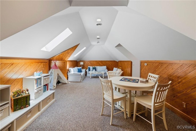 203 Randolph Square Ln, Richmond, VA 23238 - dining space with a skylight, wood walls, carpet, and lofted ceiling