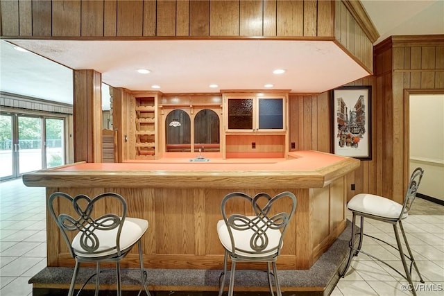 3320 Traylor Dr, Richmond, VA 23235 - indoor wet bar with light tile patterned floors and wood walls