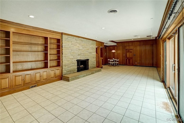 3320 Traylor Dr, Richmond, VA 23235 - unfurnished living room with crown molding, wooden walls, baseboards, a textured ceiling, and a fireplace