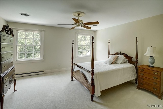 3320 Traylor Dr, Richmond, VA 23235 - bedroom with a baseboard radiator, light carpet, and a ceiling fan