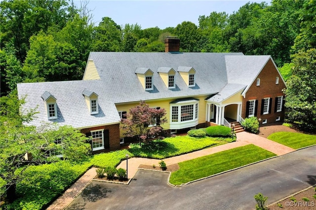 3320 Traylor Dr, Richmond, VA 23235 - new england style home featuring a chimney and a front lawn