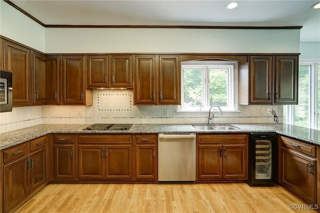 3320 Traylor Dr, Richmond, VA 23235 - kitchen with a sink, stainless steel appliances, wine cooler, light wood finished floors, and ornamental molding