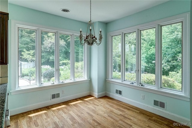 3320 Traylor Dr, Richmond, VA 23235 - unfurnished dining area with healthy amount of natural light, baseboards, and a chandelier