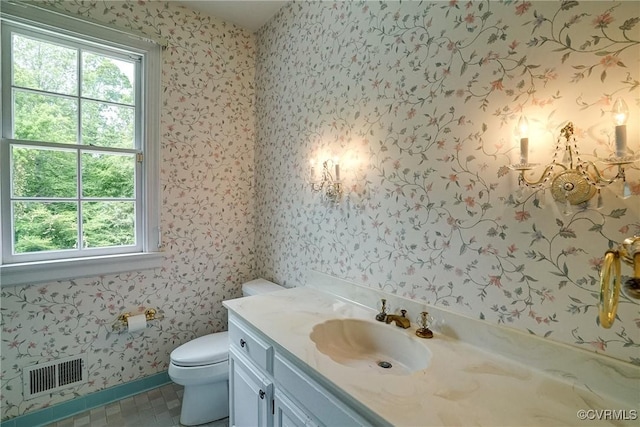 3320 Traylor Dr, Richmond, VA 23235 - bathroom featuring wallpapered walls, vanity, toilet, and baseboards