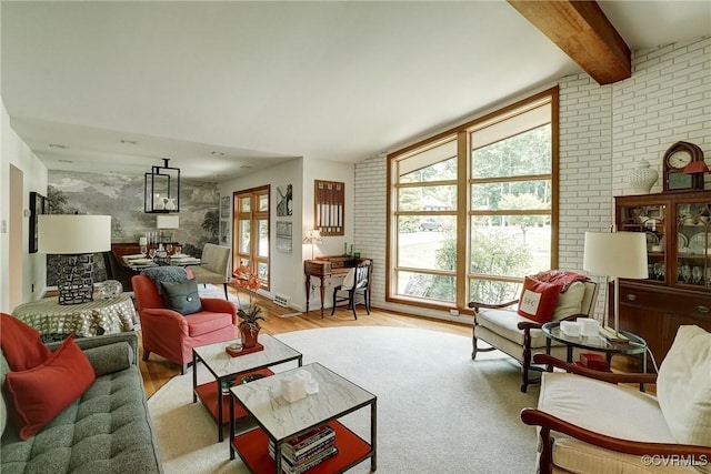 2940 Queenswood Rd, Midlothian, VA 23113 - living room featuring wood finished floors, beam ceiling, and brick wall