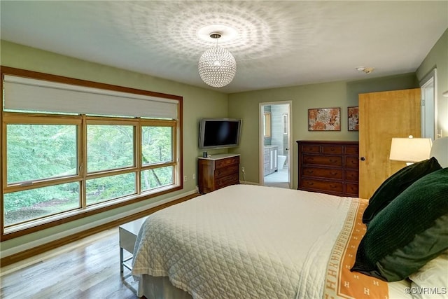 2940 Queenswood Rd, Midlothian, VA 23113 - bedroom featuring baseboards, wood finished floors, and ensuite bath