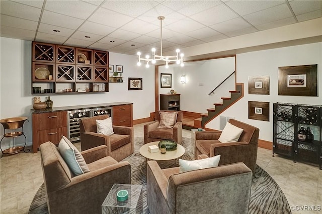 2940 Queenswood Rd, Midlothian, VA 23113 - living room with baseboards, wine cooler, stairway, a paneled ceiling, and light tile patterned flooring