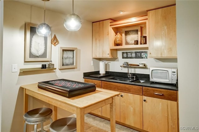 2940 Queenswood Rd, Midlothian, VA 23113 - kitchen featuring white microwave, dark countertops, a sink, and open shelves