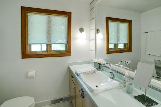 2940 Queenswood Rd, Midlothian, VA 23113 - half bathroom featuring vanity, toilet, and baseboards