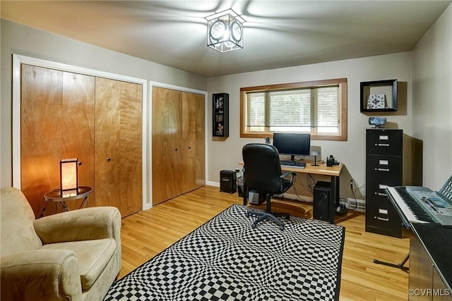 2940 Queenswood Rd, Midlothian, VA 23113 - office area featuring light wood finished floors, baseboards, and a baseboard heating unit