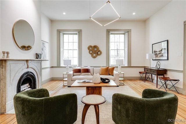 2311 E Broad St, Richmond, VA 23223 - living area with wood finished floors, plenty of natural light, a fireplace, and recessed lighting