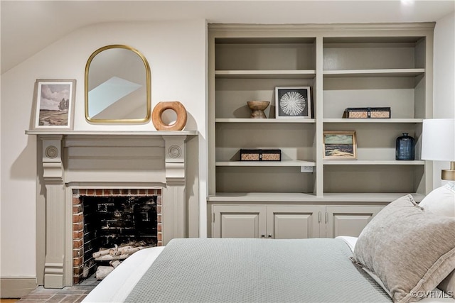 2311 E Broad St, Richmond, VA 23223 - bedroom featuring baseboards and a brick fireplace