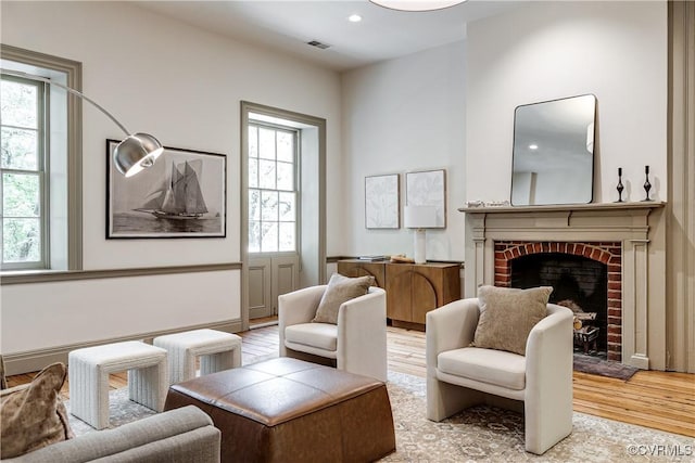 2311 E Broad St, Richmond, VA 23223 - living area featuring wood finished floors and a fireplace