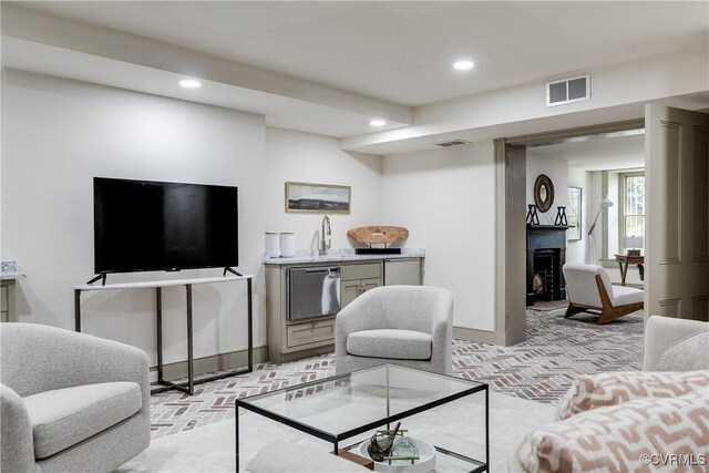2311 E Broad St, Richmond, VA 23223 - living room with brick flooring, recessed lighting, a fireplace, and bar