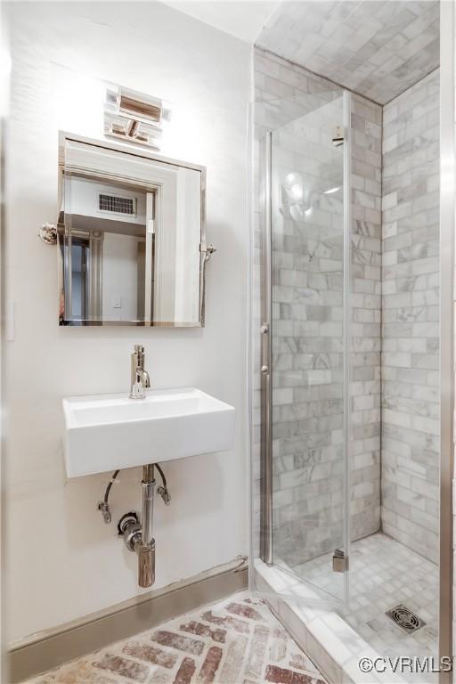 2311 E Broad St, Richmond, VA 23223 - full bathroom with a stall shower and a sink