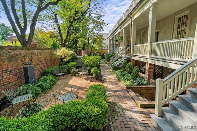 2311 E Broad St, Richmond, VA 23223 - view of yard featuring stairway and covered porch