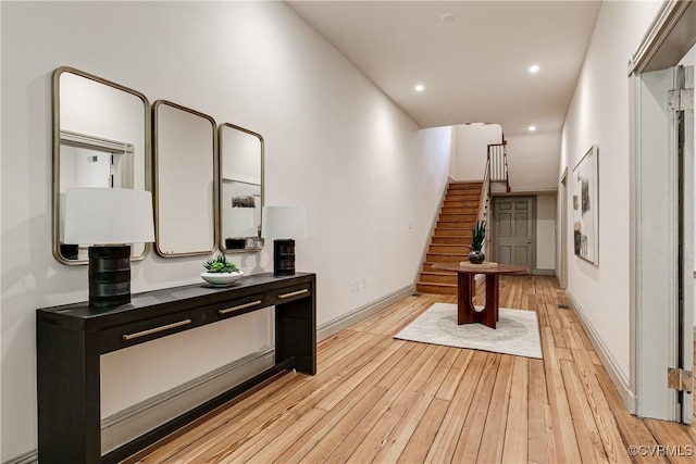2311 E Broad St, Richmond, VA 23223 - hallway with stairs, light wood finished floors, recessed lighting, and baseboards