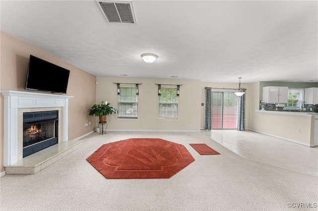 2808 Yellow Wing Ct, Henrico, VA 23231 - unfurnished living room featuring a high end fireplace, baseboards, and light colored carpet