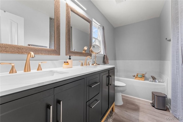 2808 Yellow Wing Ct, Henrico, VA 23231 - full bathroom featuring wood finished floors, toilet, double vanity, and a garden tub