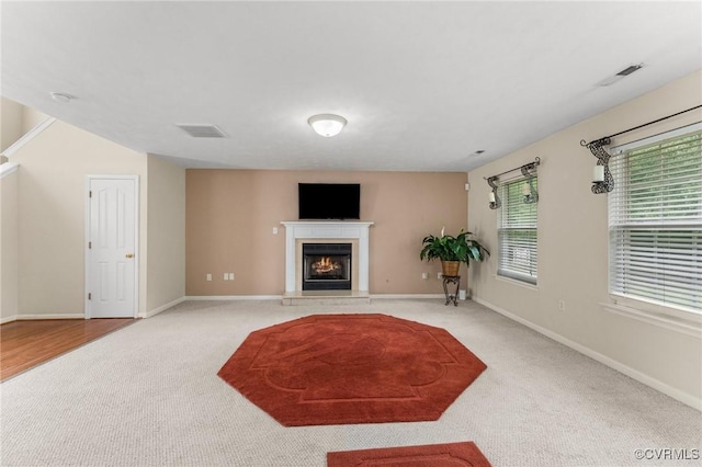 2808 Yellow Wing Ct, Henrico, VA 23231 - unfurnished living room featuring carpet, a warm lit fireplace, and baseboards