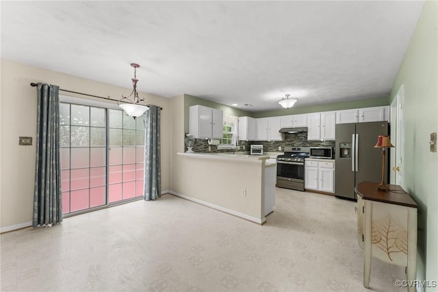 2808 Yellow Wing Ct, Henrico, VA 23231 - kitchen with appliances with stainless steel finishes, white cabinets, a peninsula, baseboards, and under cabinet range hood